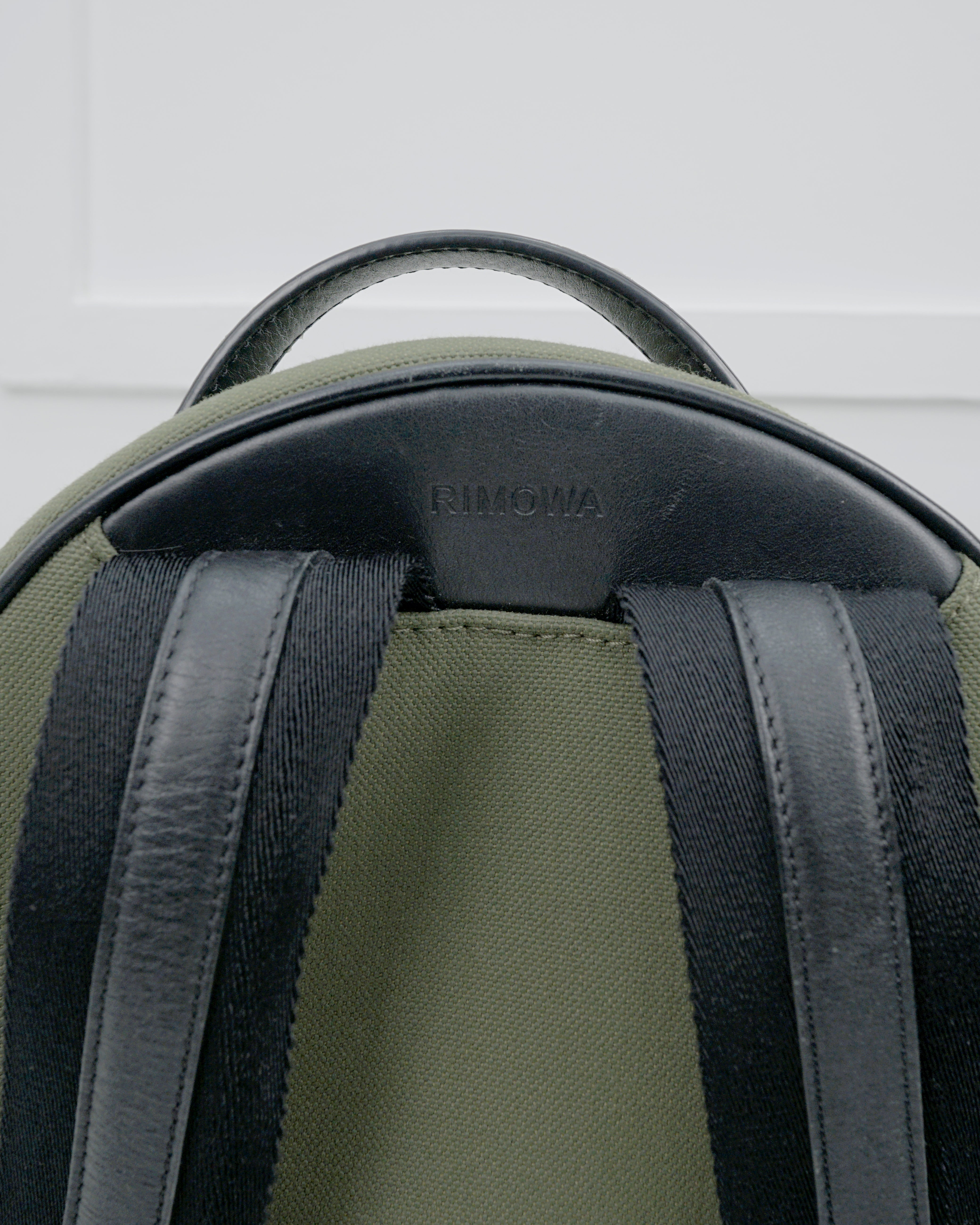 NEVER STILL BACKPACK OLIVE GREEN LEATHER-TRIMMED CANVAS