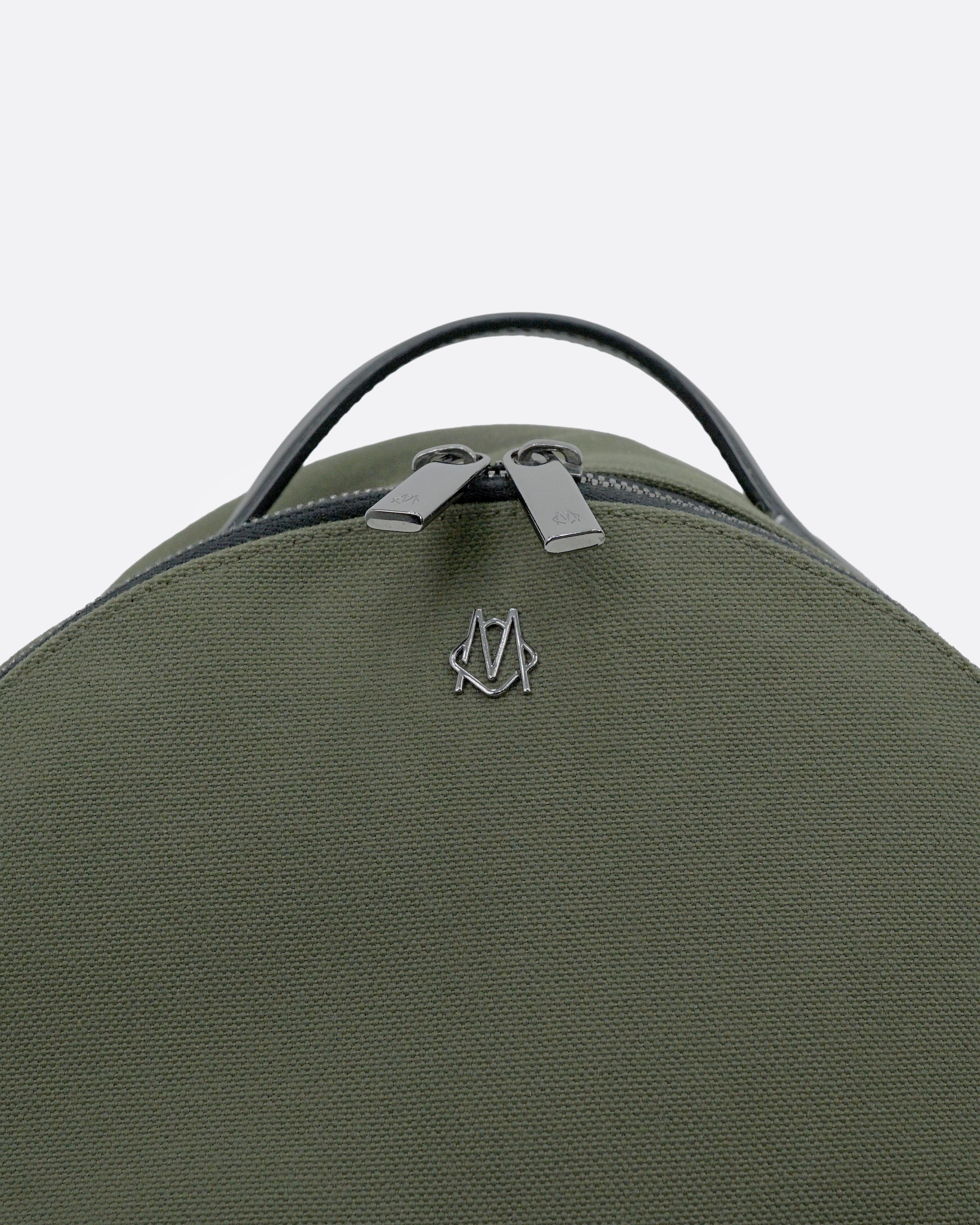 NEVER STILL BACKPACK OLIVE GREEN LEATHER-TRIMMED CANVAS