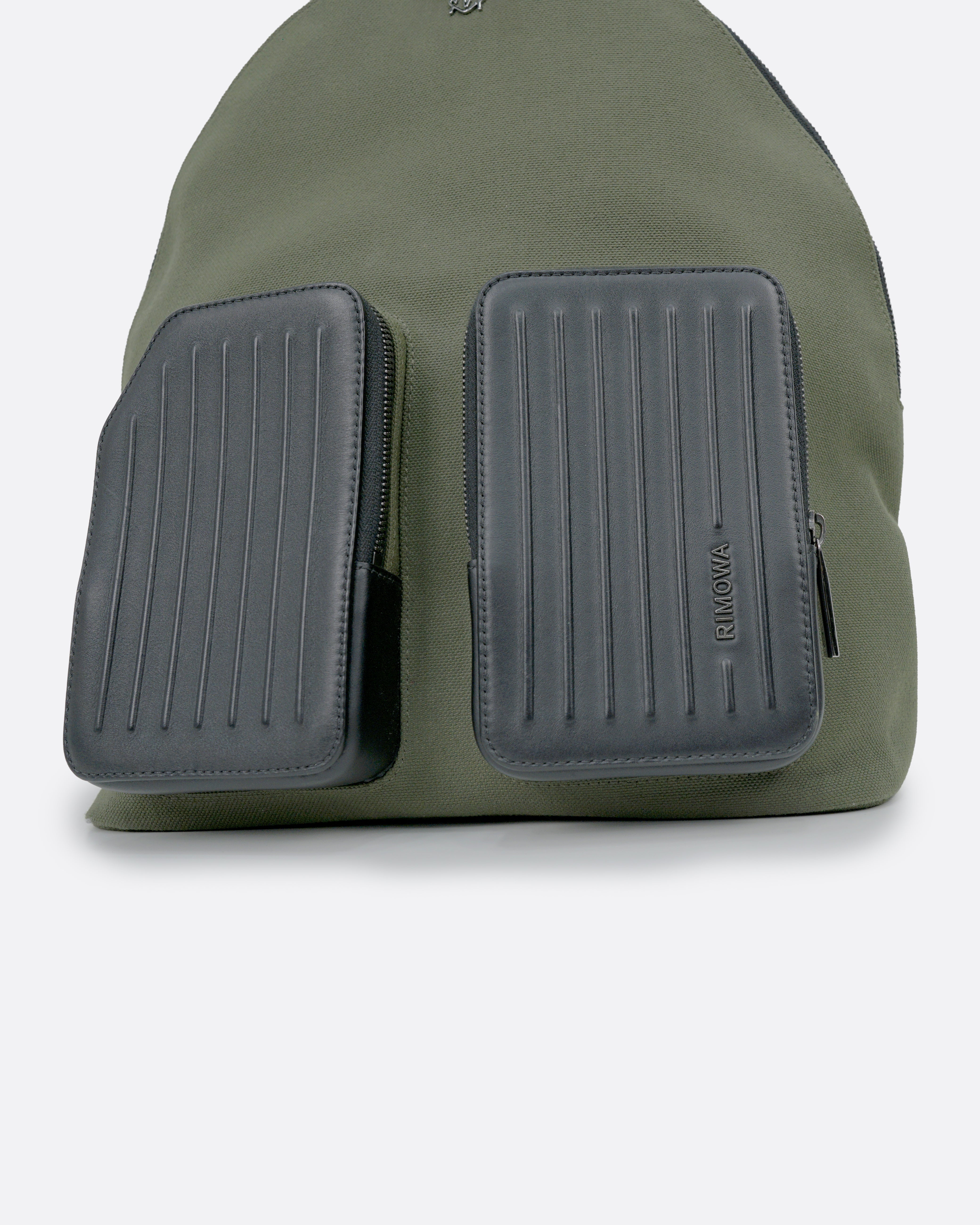 NEVER STILL BACKPACK OLIVE GREEN LEATHER-TRIMMED CANVAS