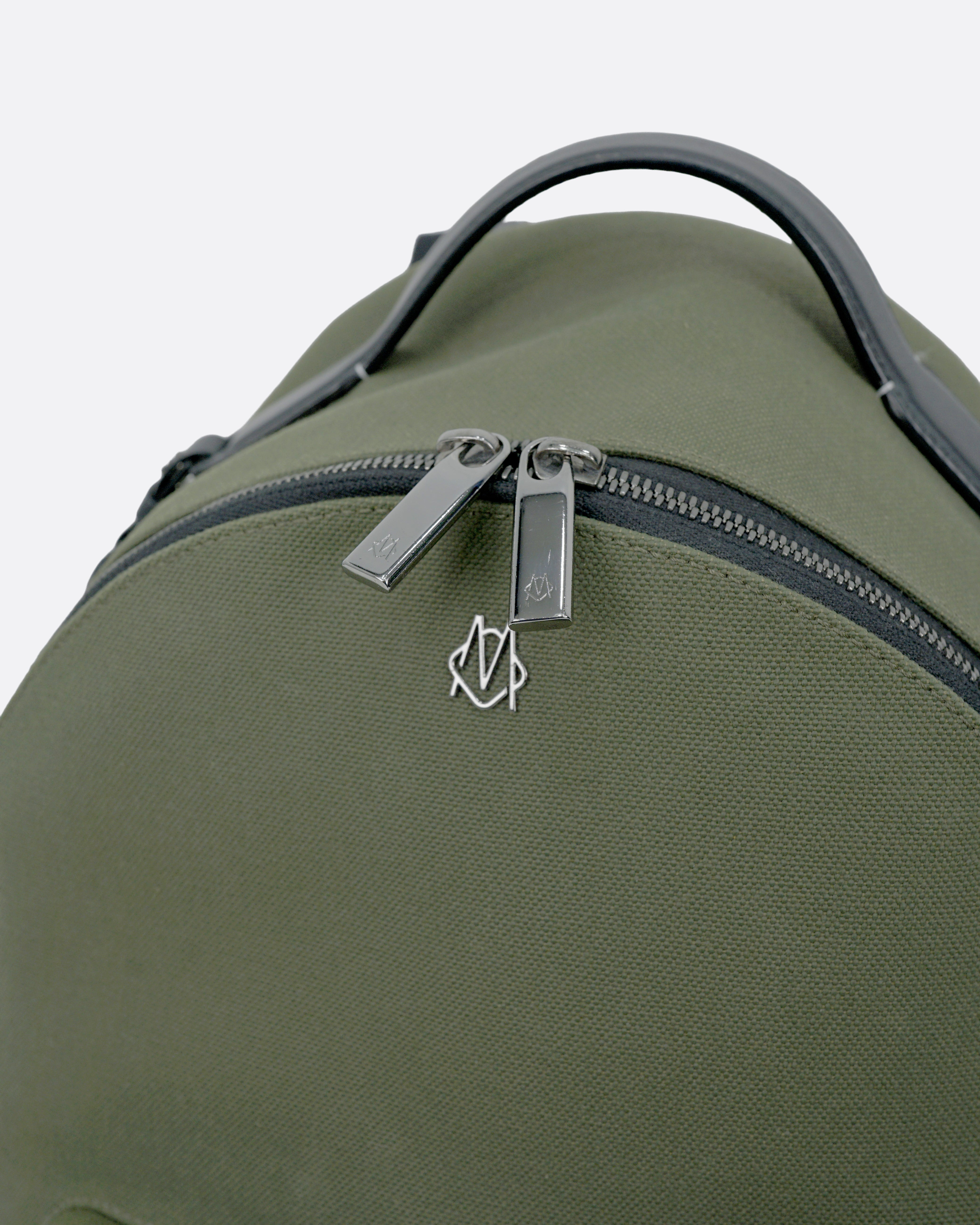 NEVER STILL BACKPACK OLIVE GREEN LEATHER-TRIMMED CANVAS
