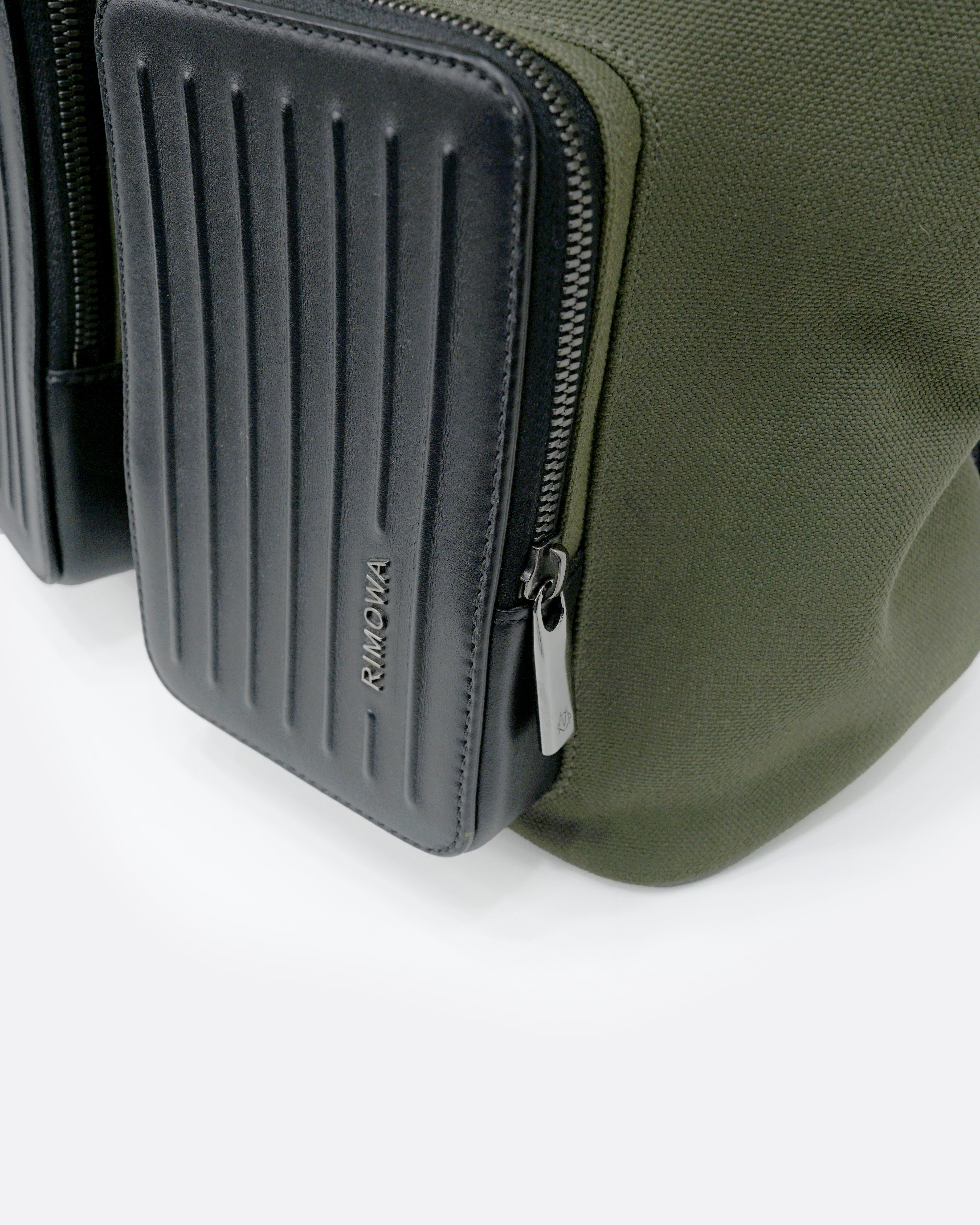 NEVER STILL BACKPACK OLIVE GREEN LEATHER-TRIMMED CANVAS