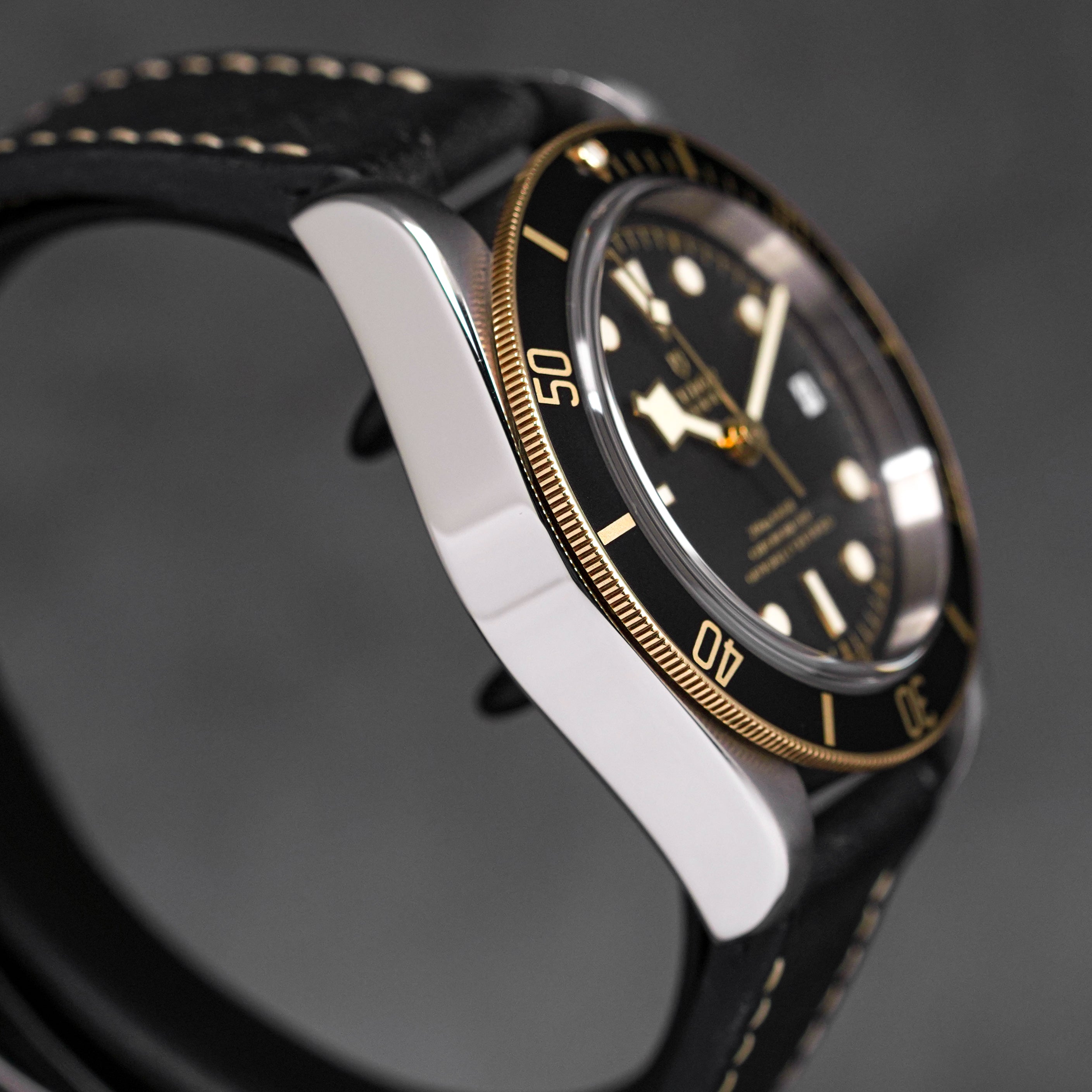 BLACK BAY TWOTONE YELLOWGOLD BLACK DIAL LEATHER STRAP (2017)