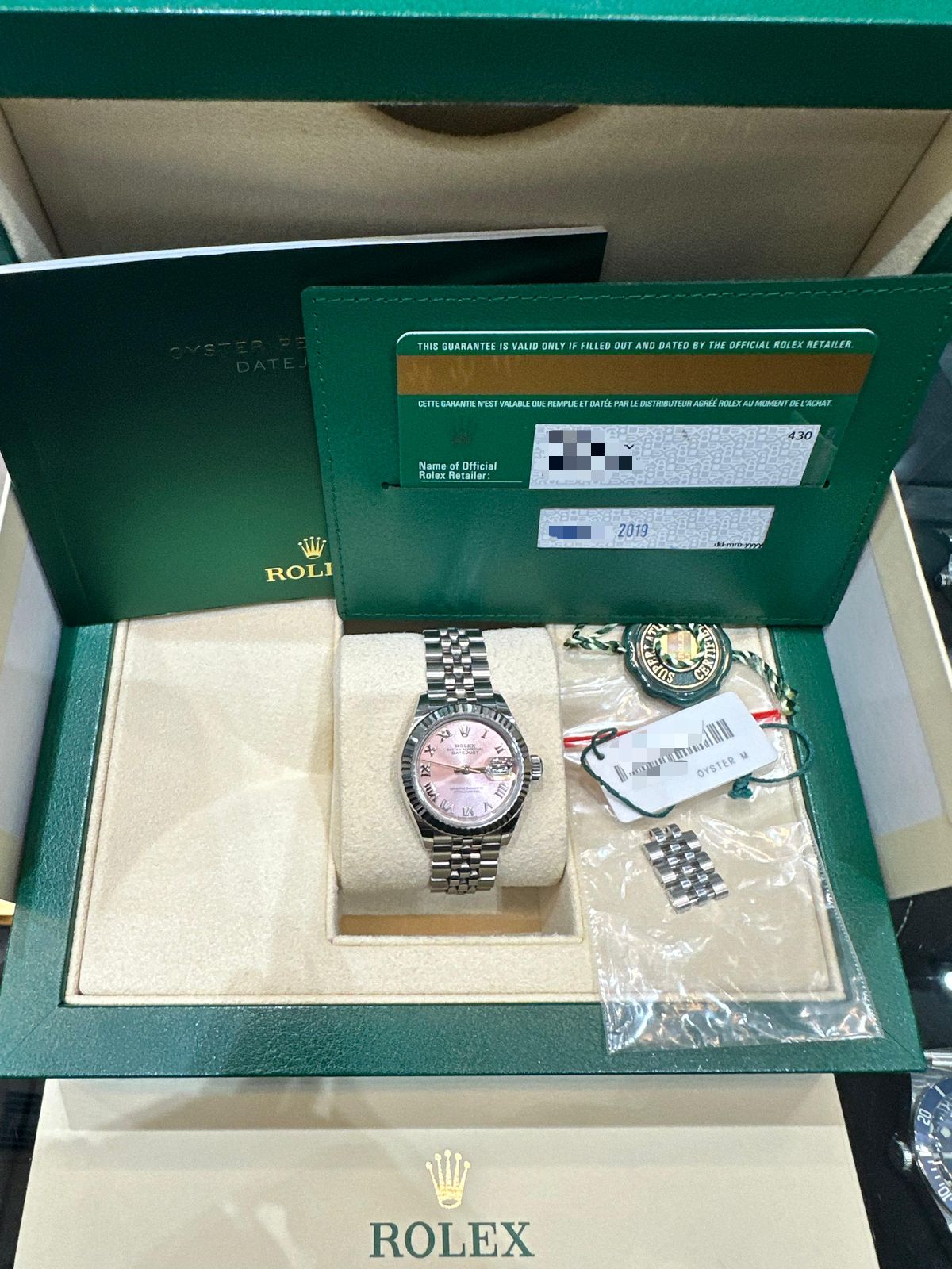 DATEJUST 28MM PINK ROMAN DIAL FLUTED JUBILEE (2019)