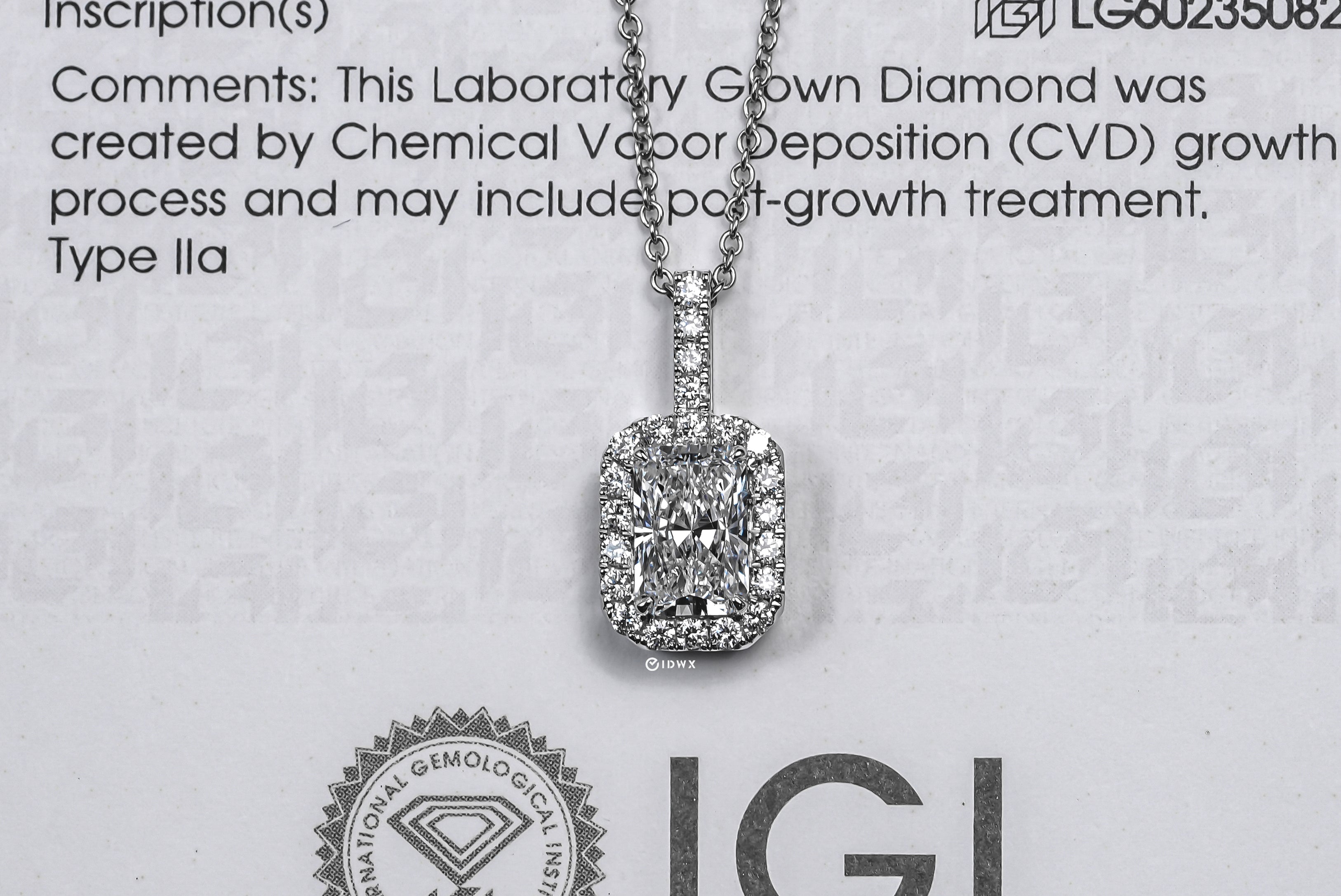 KELLY WHITEGOLD NECKLACE 1CT RADIANT CUT LAB DIAMOND WITH HALO SIDE STONE