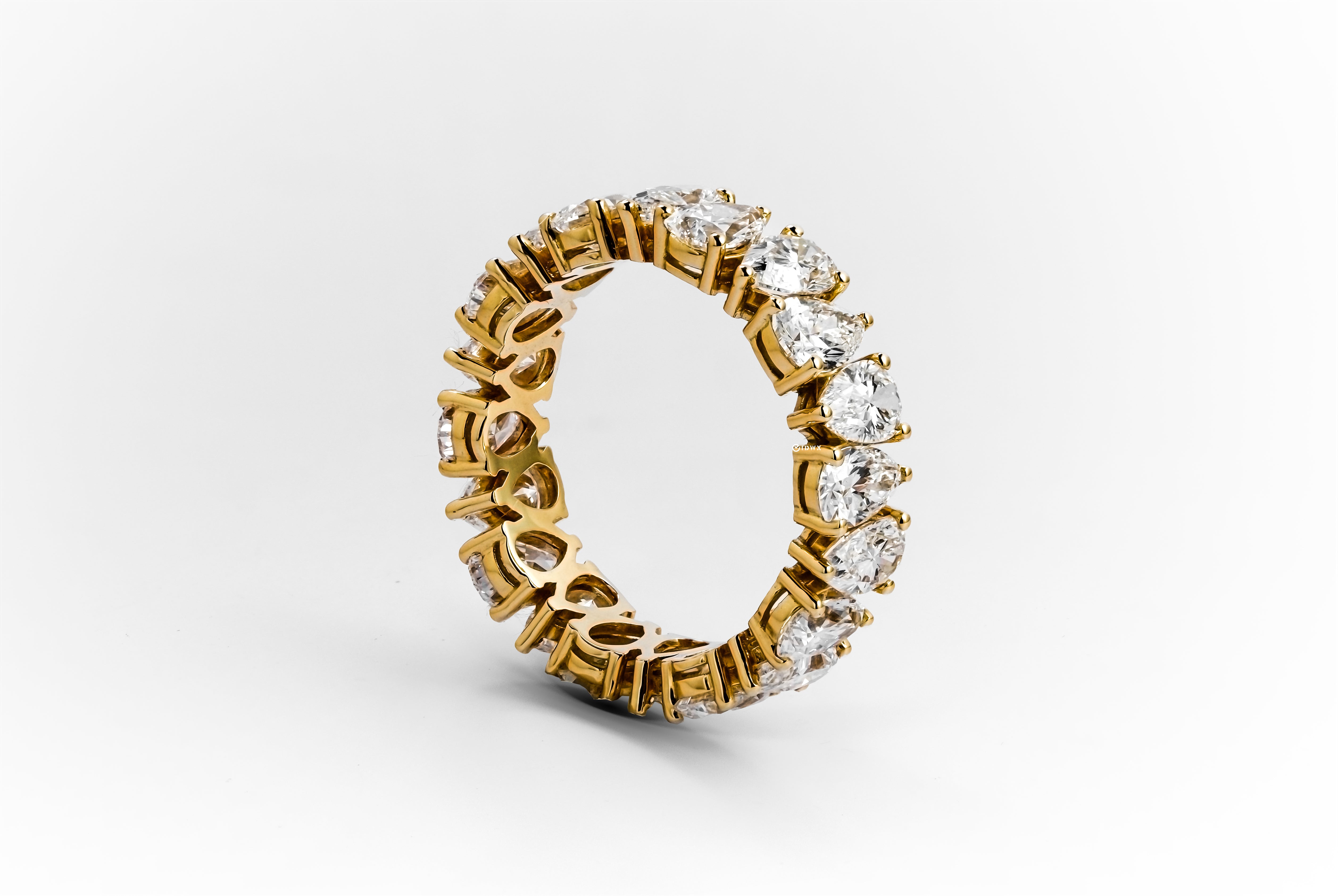 5CT PEAR BRILLIANT YELLOWGOLD ETERNITY RING