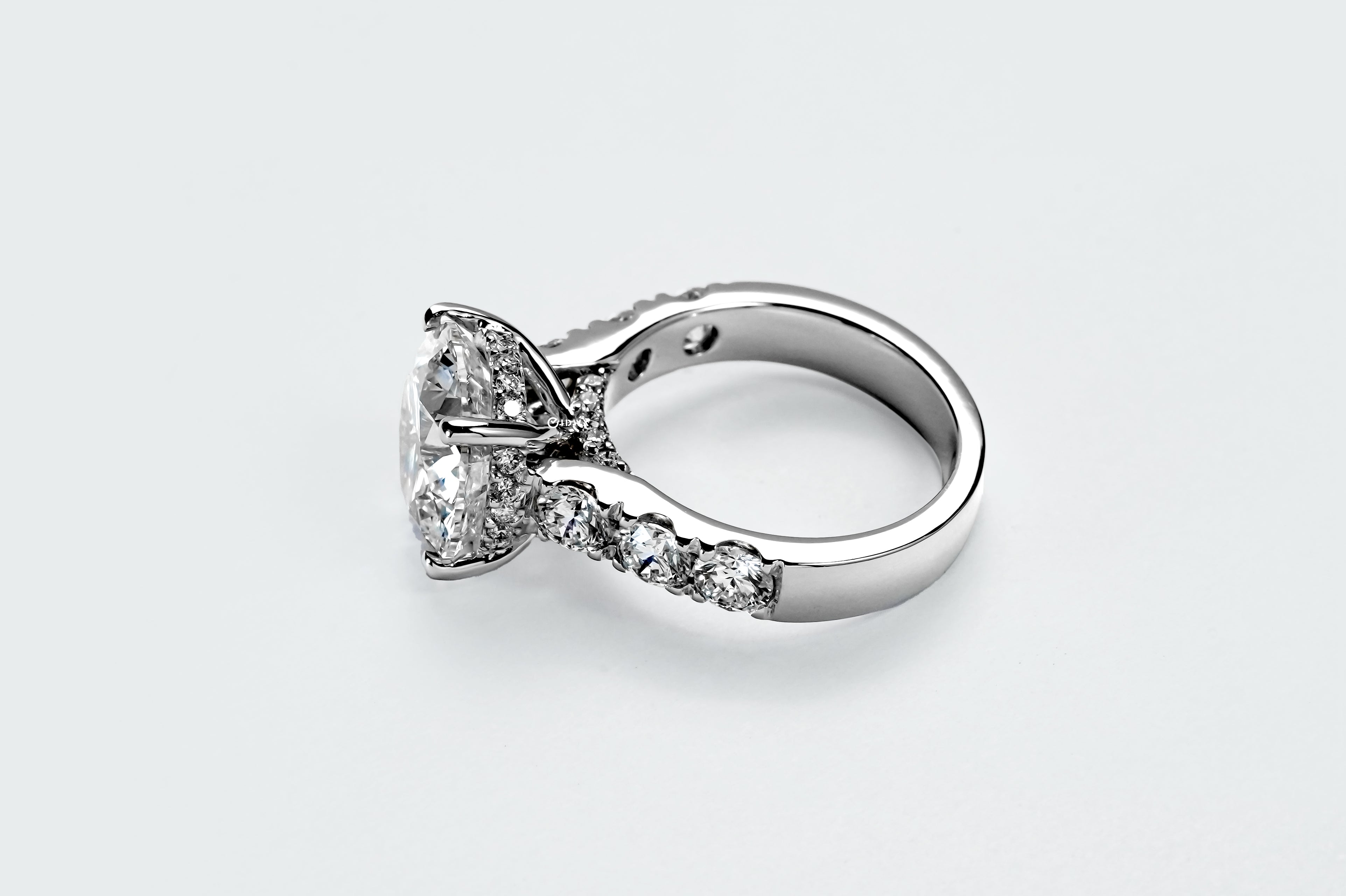 5CT ROUND BRILLIANT SIDE-STONE DIAMOND RING