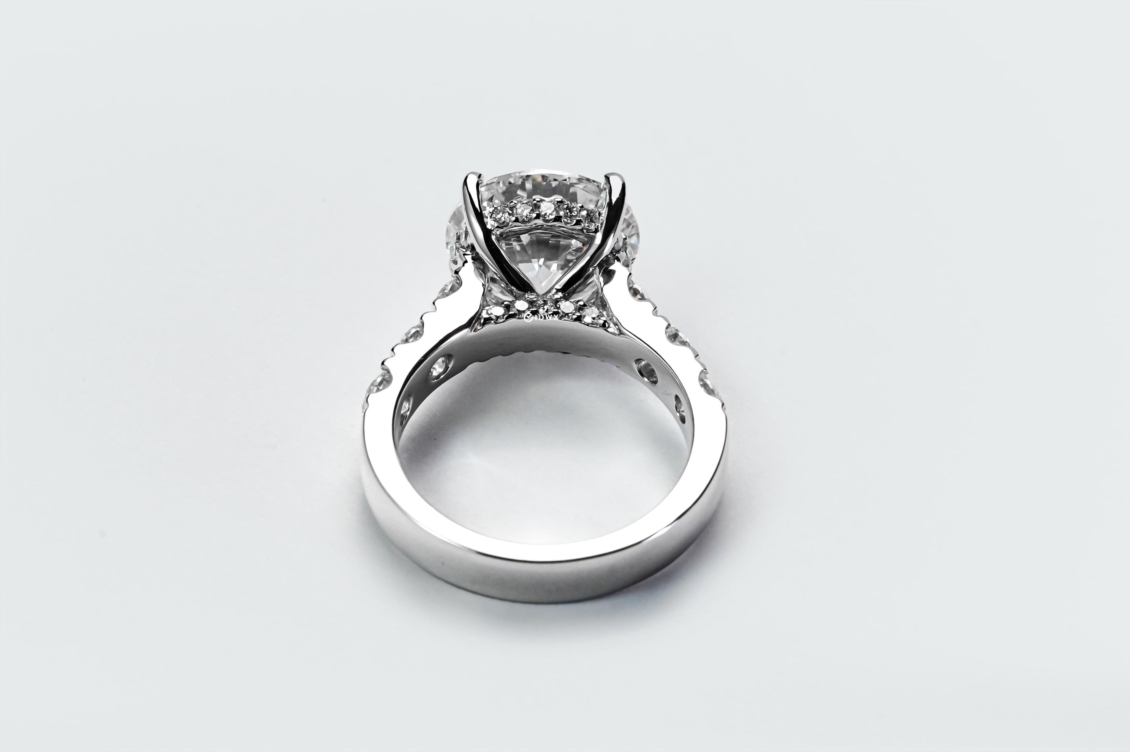 5CT ROUND BRILLIANT SIDE-STONE DIAMOND RING