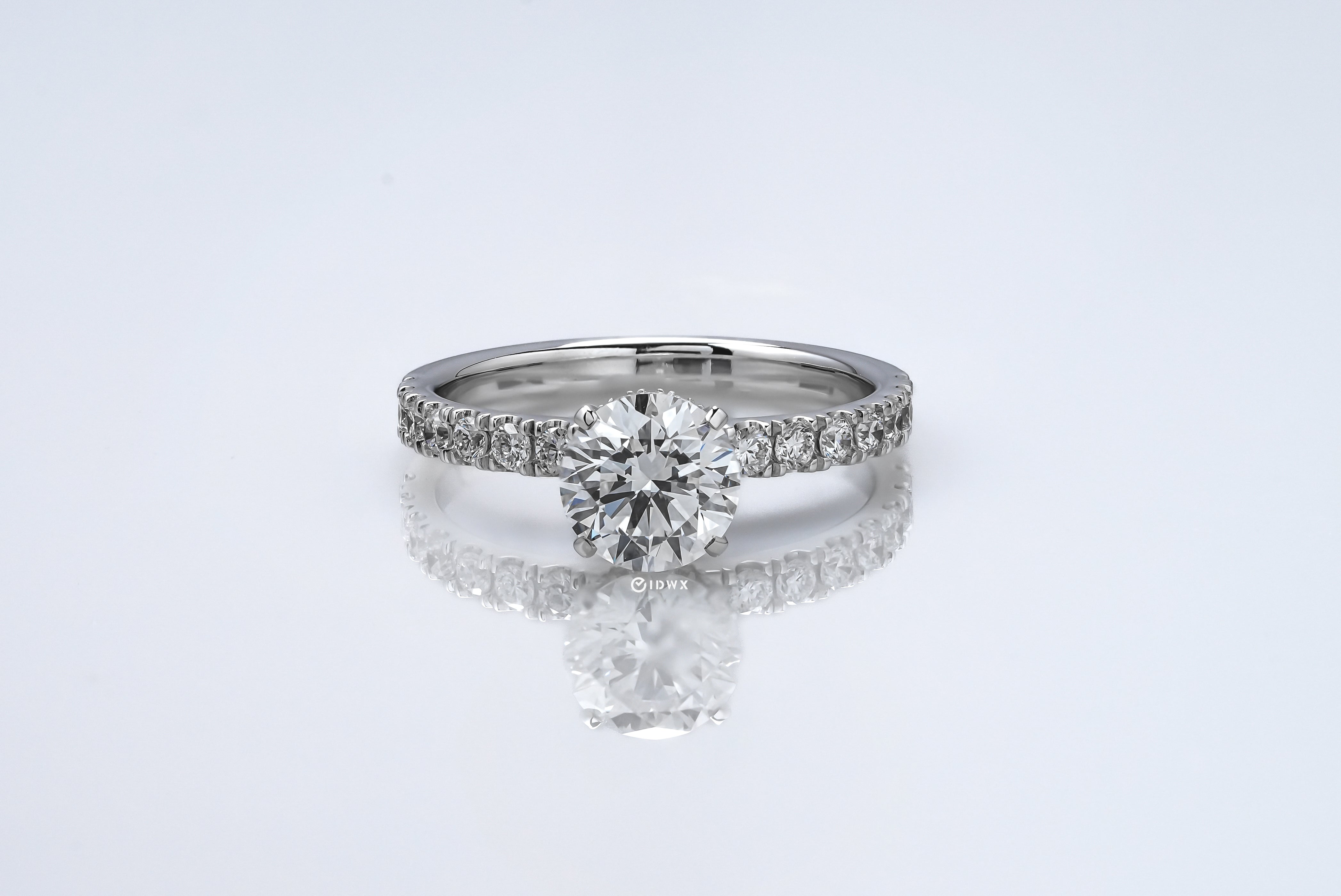 1CT ROUND BRILLIANT SIDE-STONES WHITEGOLD RING