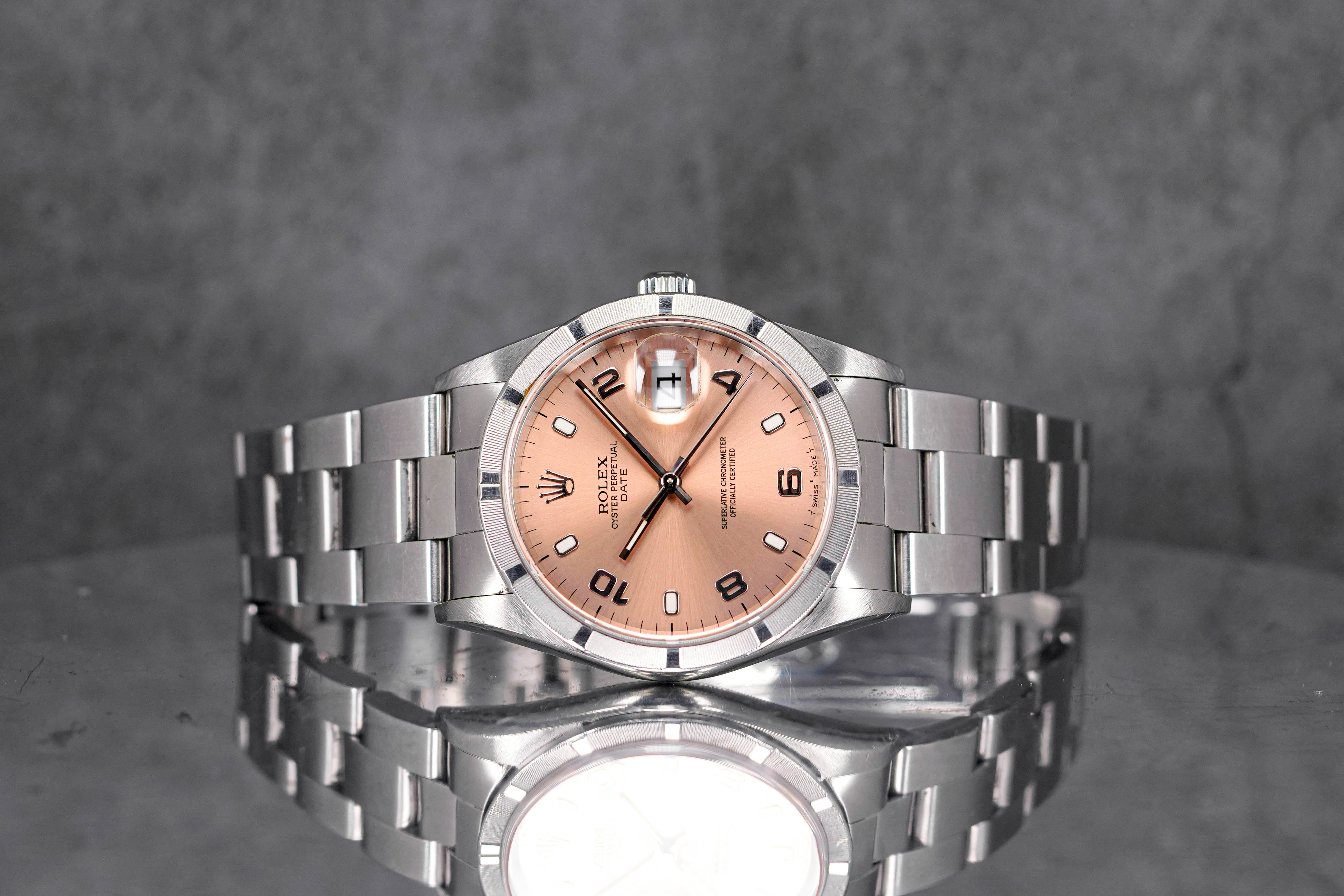 OYSTER PERPETUAL DATE 34MM 15210 ENGINE-TURNED BEZEL SALMON DIAL (1999)